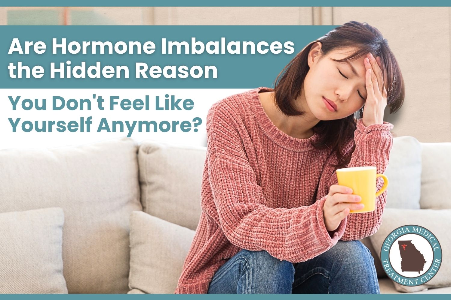 Are Hormone Imbalances the Hidden Reason You Don’t Feel Like Yourself? | Georgia MTC Young woman sitting on a couch holding a mug with her hand on her head, appearing fatigued from hormone imbalance symptoms